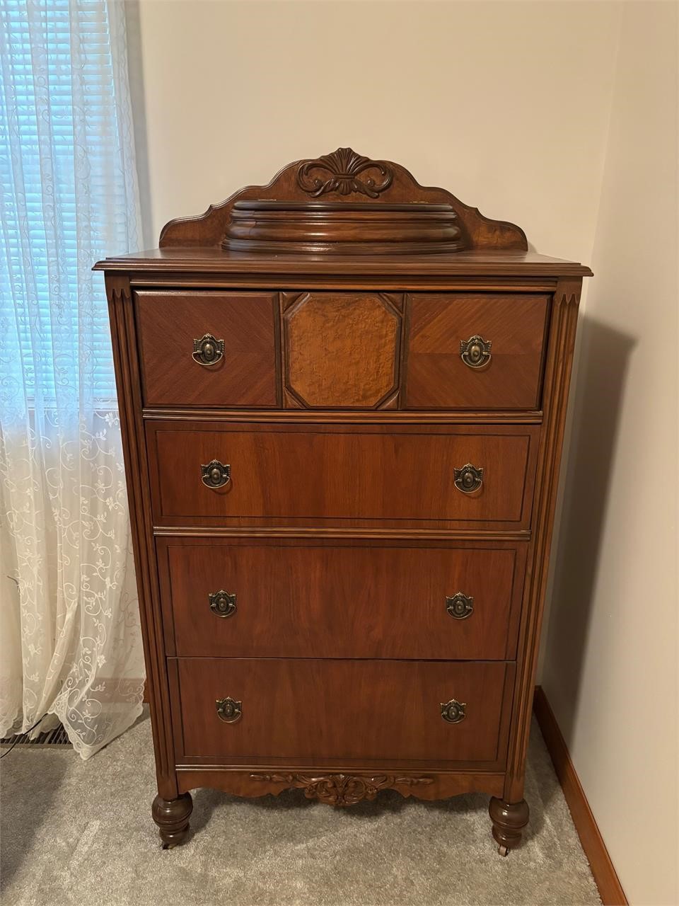 Tall antique Dresser on wooden casters