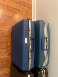 PAIR OF BLUE HARD SHELL SUITCASES