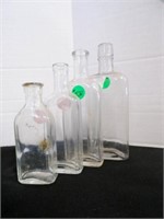 4 vintage clear glass bottles