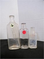 3 vintage clear glass bottles