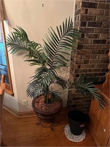 Artificial plant in pot on stand