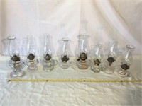 Eight vintage oil lamps.