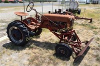 ANTIQUE I.H. CUB TRACTOR WITH FRONT END BLADE.