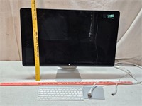 Apple computer monitor with keyboard and mouse