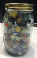 Large glass jar full of marbles