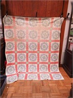 Machine-stitched quilt in a star pattern,