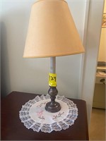 Lamp on top of nightstand