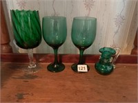 2 MATCHING GREEN GLASS WINE, ONE SWIRLED WITH