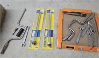 Adjustable wrenches, water heater elements, etc