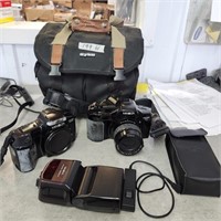 2- Minolta Digital Cameras w flash, remote & bag