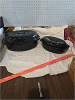 Two enamelware roasters