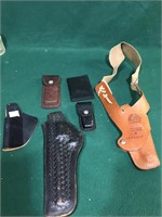Leather gun and knife holsters also including a
