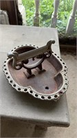 Antique plated iron boot scraper designed to be
