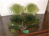 Green dishes and flower
