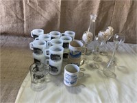 Mugs, wine decanter and wine glasses