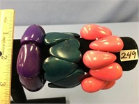 Three ivory vegetable nut bracelets - pink, purple