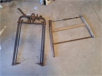 Vintage bucksaw and hay fork