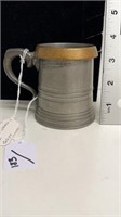 Half pint measure pewter with brass rim