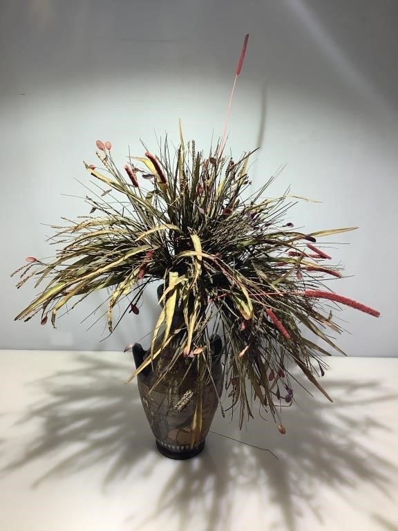 Native style pottery and faux plant.