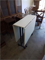 Very neat roll around drop leaf work table with