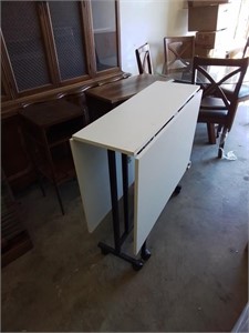 Very neat roll around drop leaf work table with