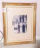 Framed and matted photo of statues in gold frame