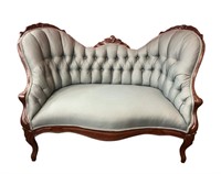 Victorian settee with floral carved crestrail.