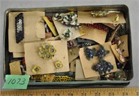 Vintage costume jewellery in tin