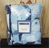 New blue patchwork style twin quilt. 66" x 86"