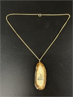 Walrus ivory, intricately scrimmed pendant with ch