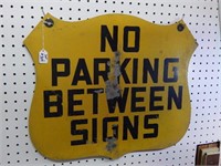 "No parking between sign ' tin sign