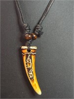 Hand carved bone tooth necklace