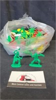 Bag of plastic army men and misc toys