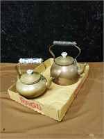 Pair of copper teapots