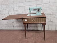 Silnger sewing machine in rare cabinet!