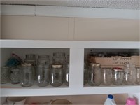 Cabinet full of Mason jar's Canning.