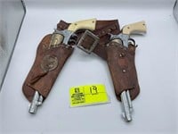 SET OF TWO CAP GUNS WITH LEATHER HOLSTER.  BOTH CO