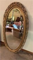 Large oval beveled mirror 24x47in.