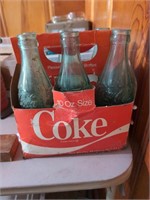 Vintage glass coke bottles in carrier bottles