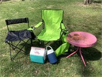 2 folding chairs, table, and coolers