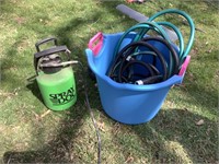 Bucket of hoses with sprayer