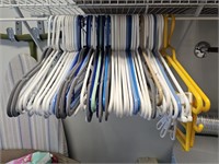 Assortment of Plastic and Felt Clothes Hangers