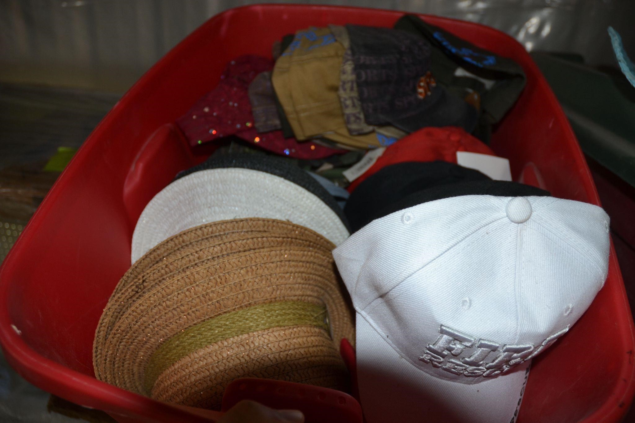 Red bin full of various style hats