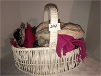 Basket with bows, 2 hats, and scarves