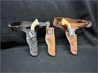 (2) VTG. KIDS SIX SHOOTER CAP GUNS AND HOLSTERS