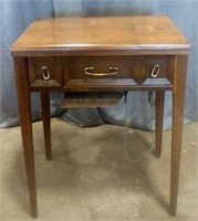 Sewing cabinet with Singer sewing machine
