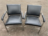 PAIR OF CHROME ARM CHAIRS WITH BLACK PADDING