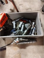 Tub full of pneumatic tools, including chisel,