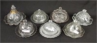 Group of Seven Clear Glass Butter Dishes
