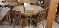 round table with 4 leaves and 4 chairs